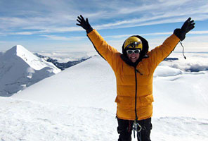 IMG climber on the summit of Illimani, Bolivia