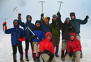 International Mountain Guides climbers on the summit of Mt Rainier. Photo by Jason Edwards