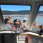 The gang on the Grey II having a drink chilled by grey glacier ice (Photo: Tye Chapman)