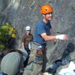 Lead instructors Jeff Ward (foreground) and Olivia Race (belaying) ready to start a crack climbing demo. Josh Smith is observing.
