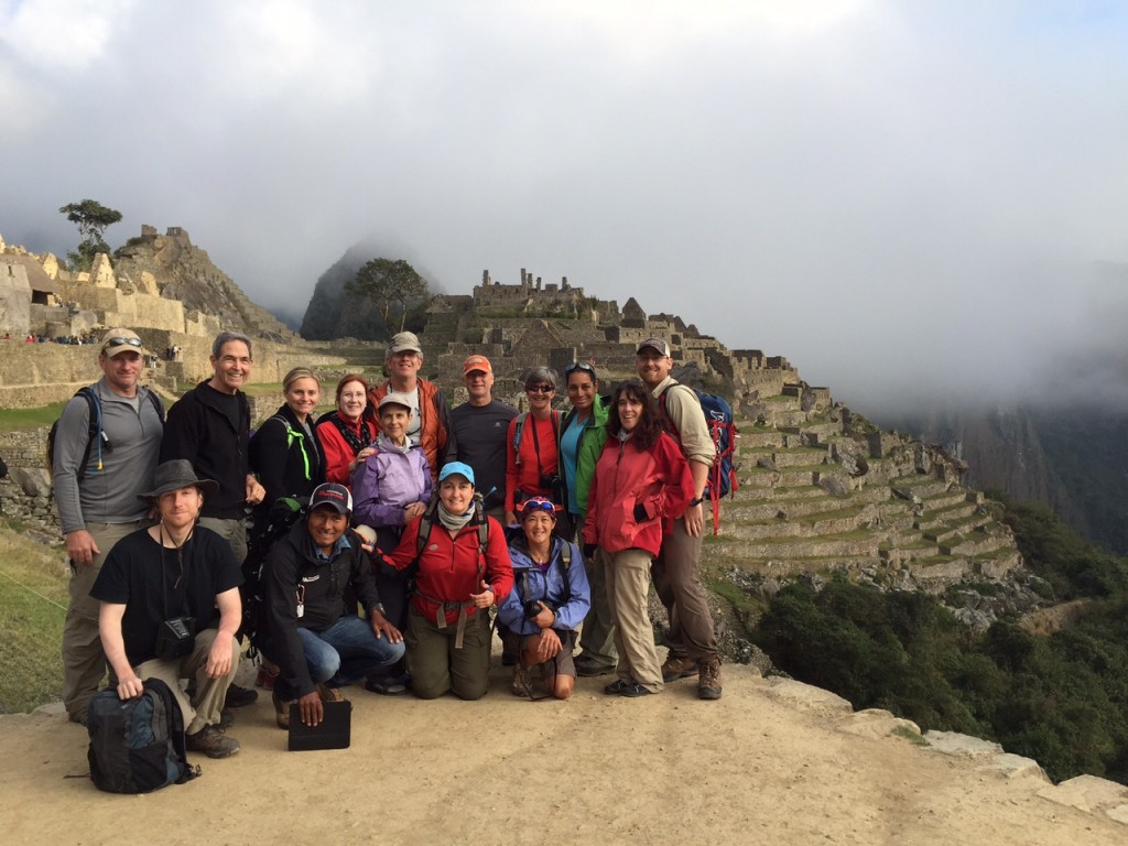 The team poses in front of the ruins of Machu Picchu