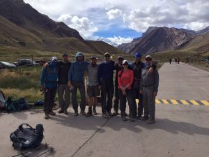 Team at the trailhead with the south face of Aconcagua - â€˜in the rear view mirrorâ€™ - 