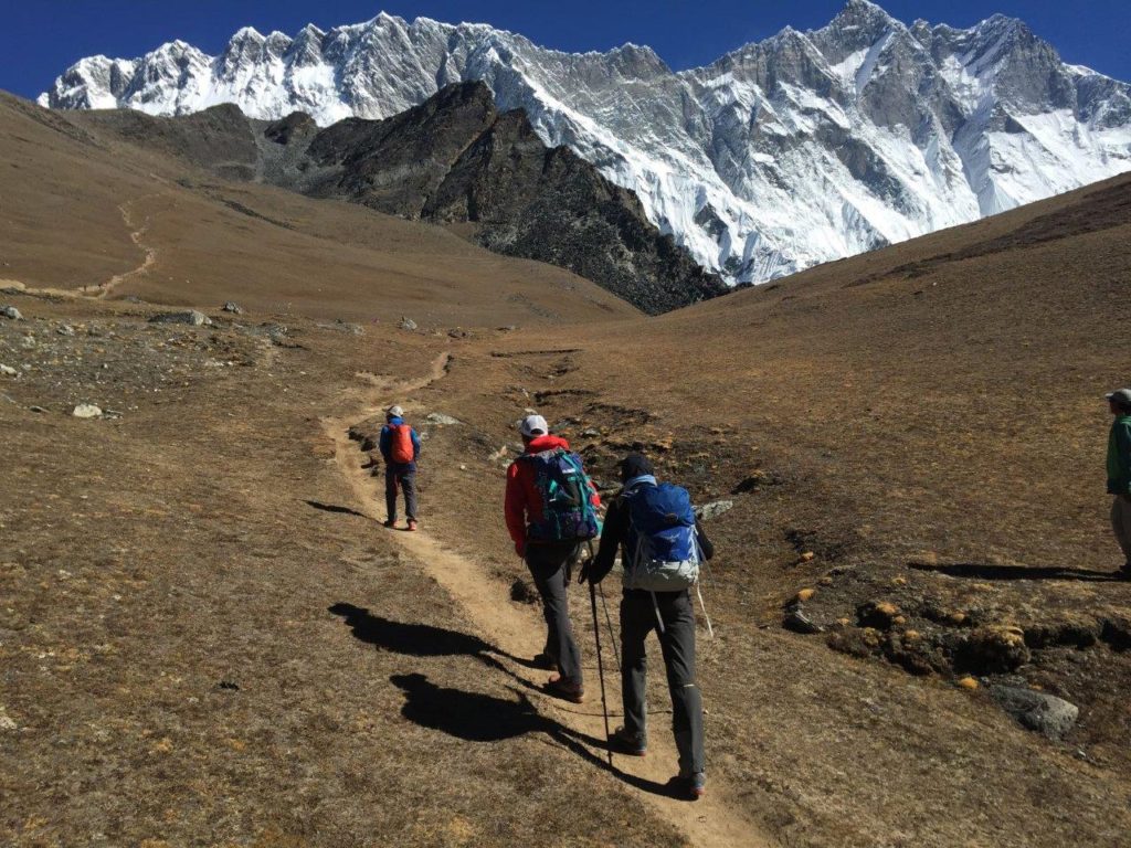 Heading up Chukhung Ri with Nuptse and Lhotse behind (Eric Simonson)