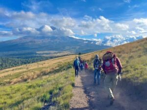 Trekking with Popo in the distance (Emily Johnston)