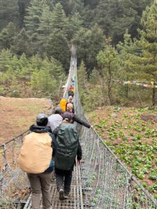 Suspension bridge crossing on the way to Monjo (Phunuru Sherpa)