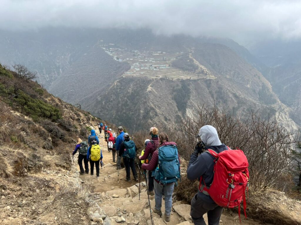 Trekking with Phortse in the distance (Phunuru Sherpa)