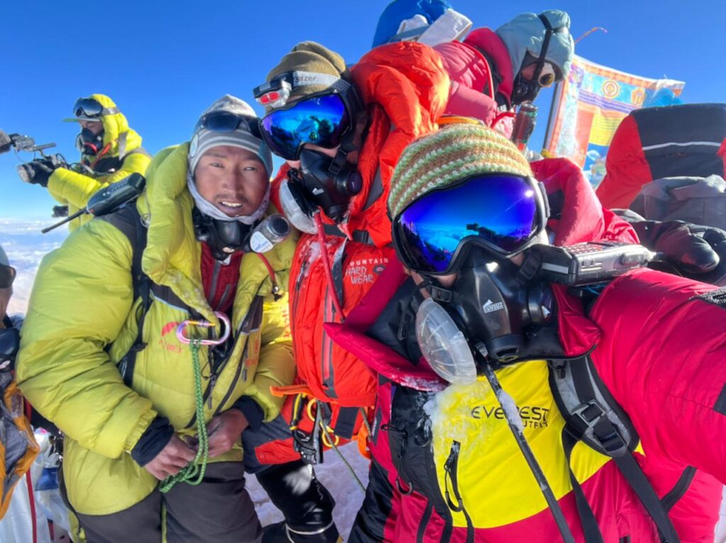 IMG Climbers on the summit of Mount Everest (Phunuru Sherpa)
