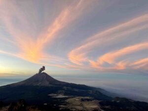 Nearby volcano Popocatepetl issues some ash (Porter McMichael)